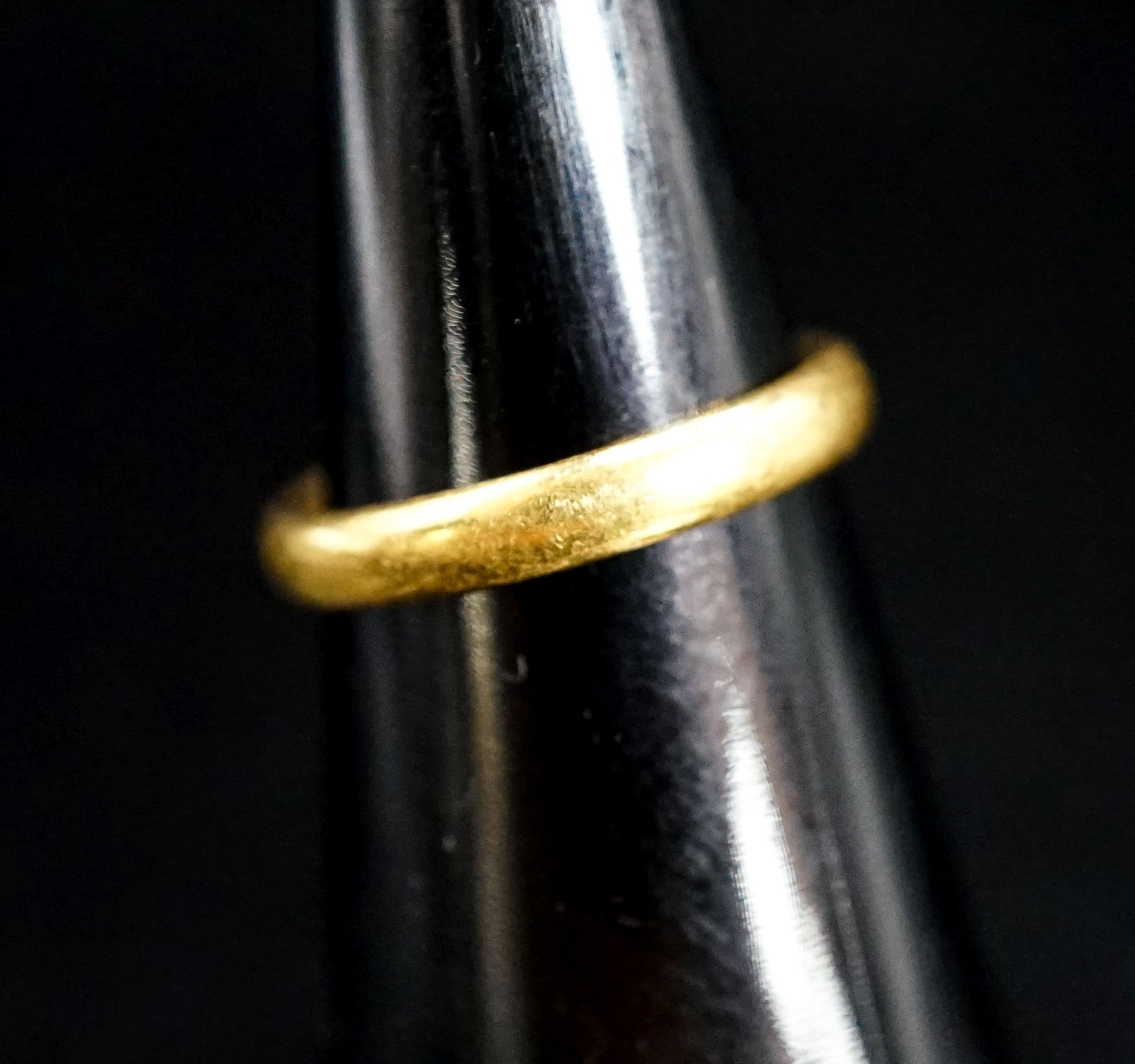 A 22ct gold wedding band, size L/M, 4.6 grams.